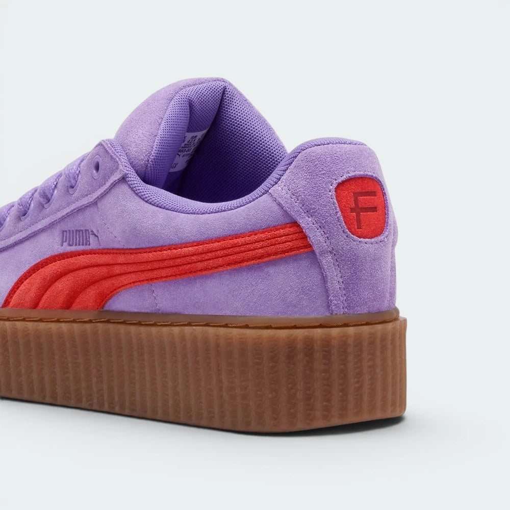 Focuses on the debossed FENTY branding and the professional finish of the stacked heel.