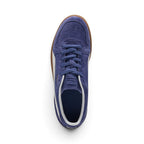 Direct overhead view of the shoe, displaying the perforated suede toe vamp, tonal Blue Crystal flat laces, embossed suede tongue, and dark cushioned footbed with white collar lining.