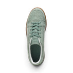 Direct overhead view of the shoe, displaying the perforated suede toe vamp, tonal Green Moon flat laces, embossed suede tongue, and dark cushioned footbed with white collar lining.