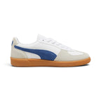 Medial perspective highlighting the inner profile of the shoe, featuring the smooth white leather quarter, Clyde Royal blue suede Formstrip, suede toe wrap, and textured gum rubber cupsole sidewall.