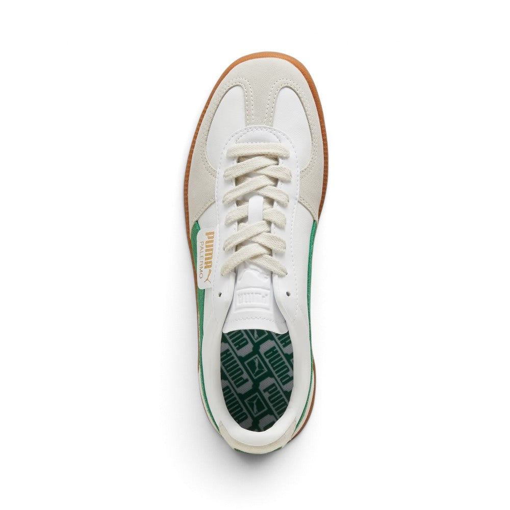 Direct overhead view of the shoe, displaying the Vapor Grey suede T-toe mudguard, white leather vamp, flat off-white laces, embossed white leather tongue, fold-over PUMA flap label, and green cushioned footbed printed with repeating PUMA logos.