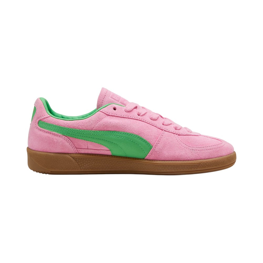 Medial perspective highlighting the inner profile of the shoe, featuring the solid Pink Delight suede quarter, PUMA Green smooth leather Formstrip, reinforced toe wrap, and clean gum rubber cupsole sidewall.
