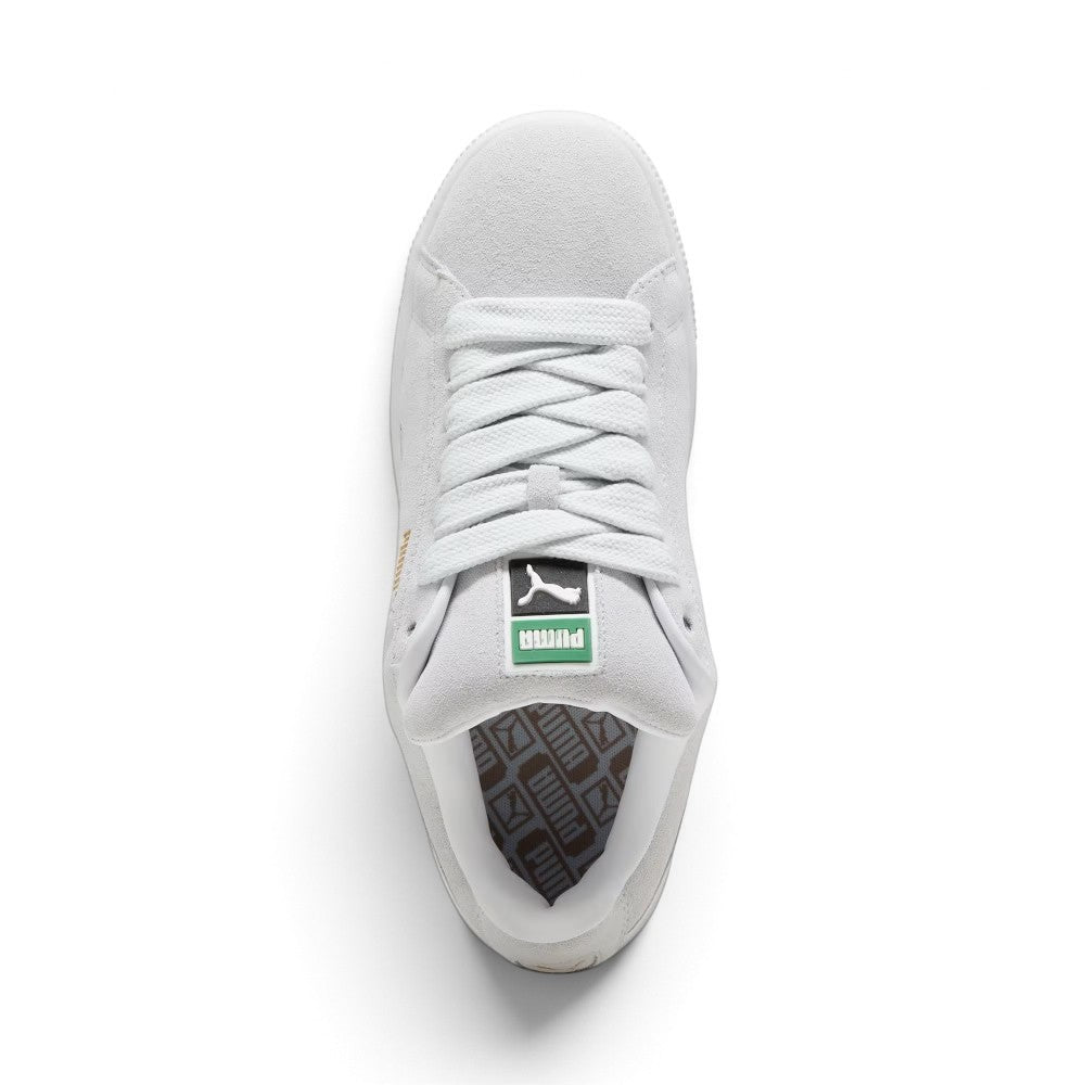 Overhead look at the shoe highlighting the Silver Mist suede toe box, ultra-wide lacing throat with chunky white fat laces, heavily padded foam tongue with green-and-white retro PUMA woven label, and plush white interior collar lining.