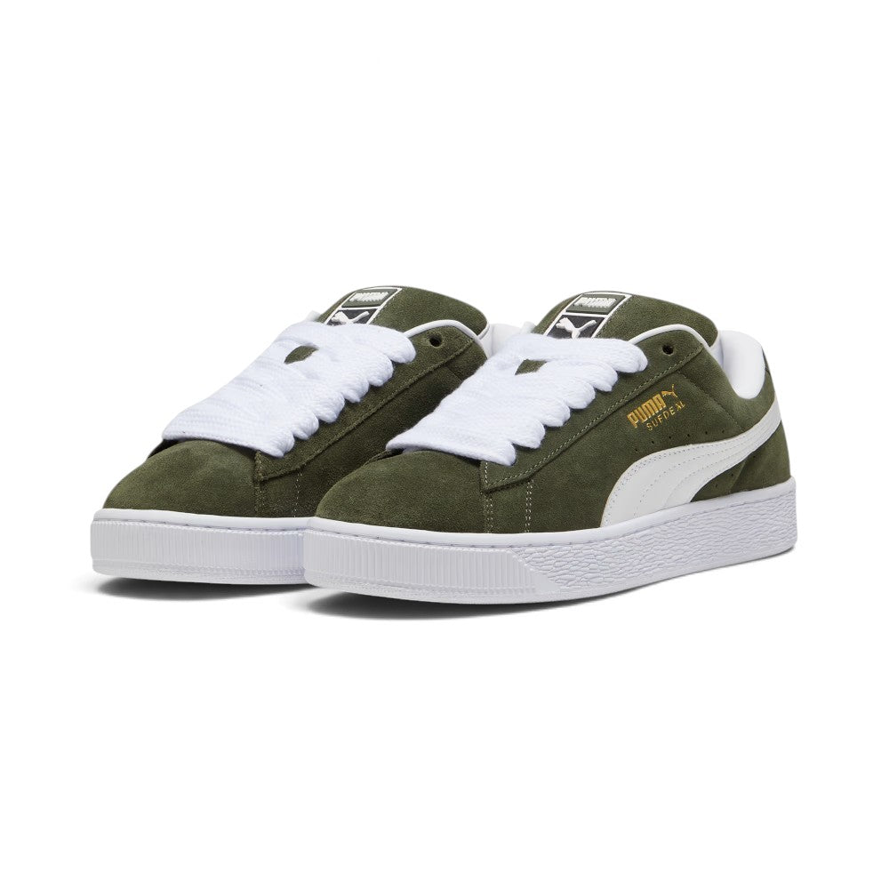 Forward three-quarter angle showcasing both shoes side by side, highlighting the exaggerated Y2K skate proportions, contrast white leather Formstrips, chunky silhouette, and bold low-top stance.