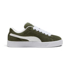 Crisp lateral profile showcasing the low-top silhouette, detailing the rich Dark Olive velvety suede upper, clean contrast white stitching, and signature Puma White leather Formstrip. The angle highlights the exaggerated padded collar with white plush lining, prominent puffy tongue with woven branded label, ultra-thick white fat laces threaded through punched suede eyelets, and the elevated white rubber cupsole featuring textured foxing and ribbed vertical bumper detailing around the toe.