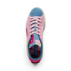 Direct overhead view of the shoe, displaying the Blue Horizon suede toe box, Orchid Shadow hairy suede vamp, flat pink laces threaded through zig-zag eyestays, co-branded tongue tab, and custom graphic footbed referencing the show's arena graphics.