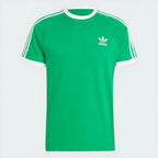 Top-down view of the tee laid flat, highlighting the contrast white round neck and the embroidered Trefoil logo on the chest.