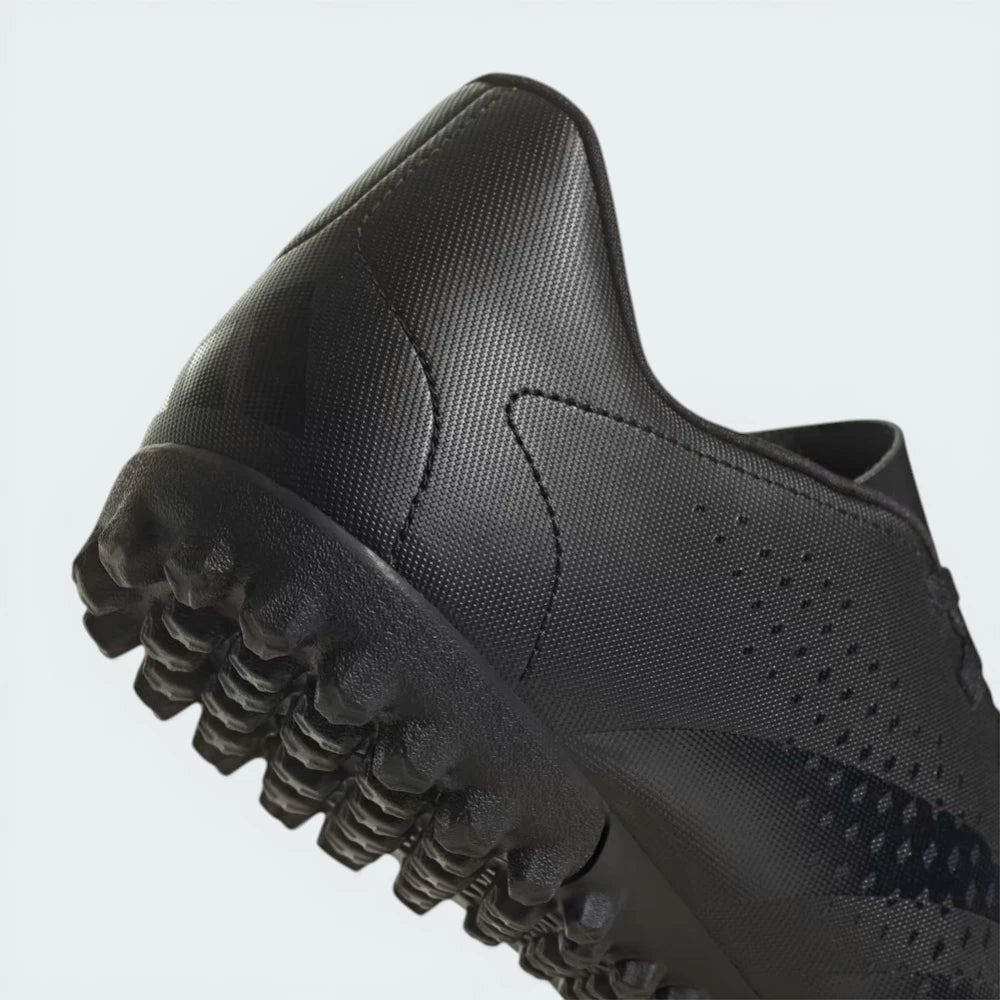 Zoom looking at the outsole and midsole, showcasing the density of the turf lugs and the durable construction.