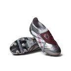 Studio layout of the adidas Predator Elite Jude Bellingham firm ground boots in Silver Metallic and Legacy Burgundy, showcasing one boot upright with the burgundy fold-over tongue and the second boot displaying the chrome-finished Controlframe 2.0 outsole.