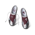 Overhead layout of the paired boots, displaying the silver flat laces, the vibrant legacy burgundy fold-over tongues featuring Jude Bellingham's signature "JB" branding, and custom insoles.