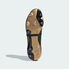 The Controlplate 2.0 frame, showcasing the strategic gold-tipped stud configuration for firm ground surfaces.