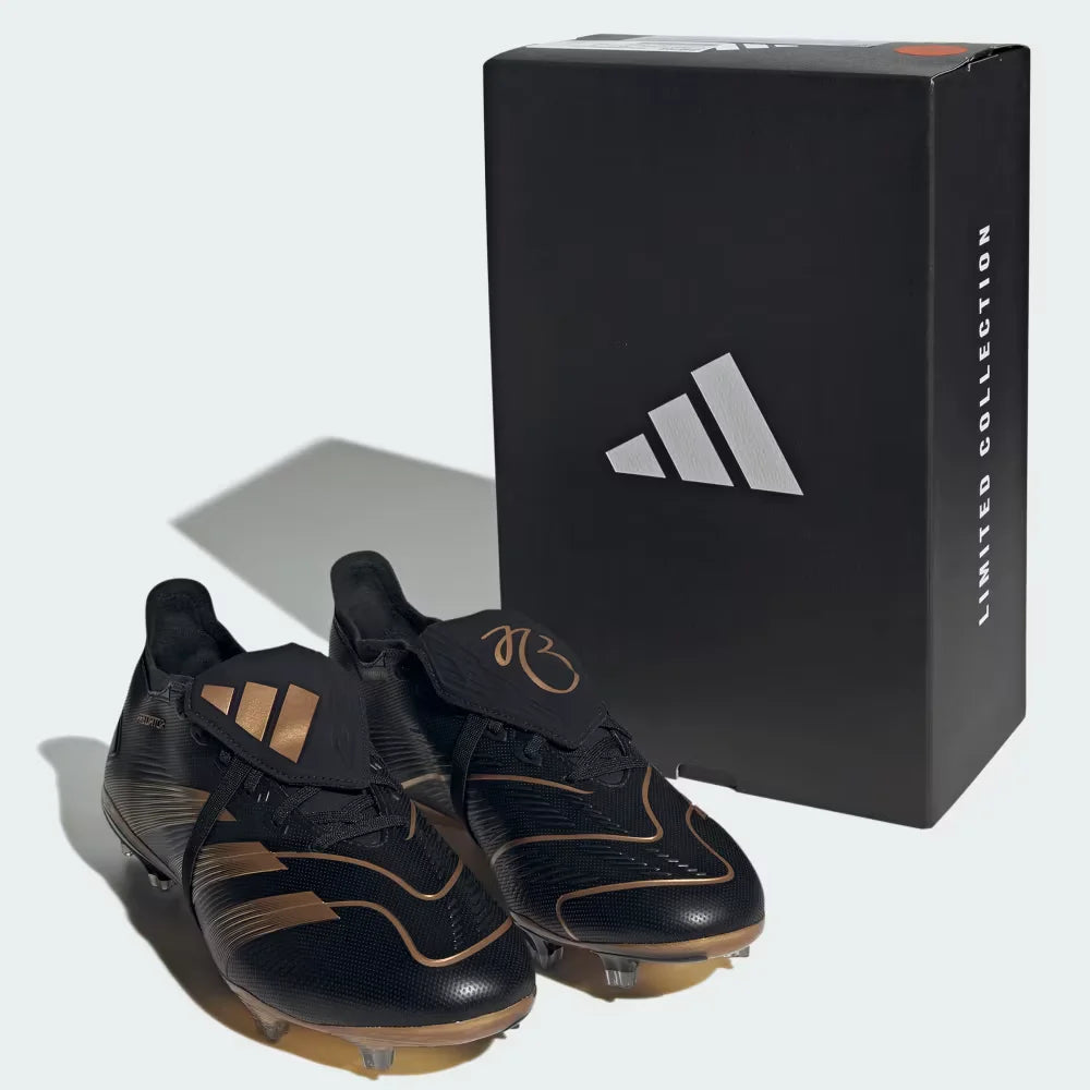 Black and gold soccer cleats with a black Adidas box on a white background