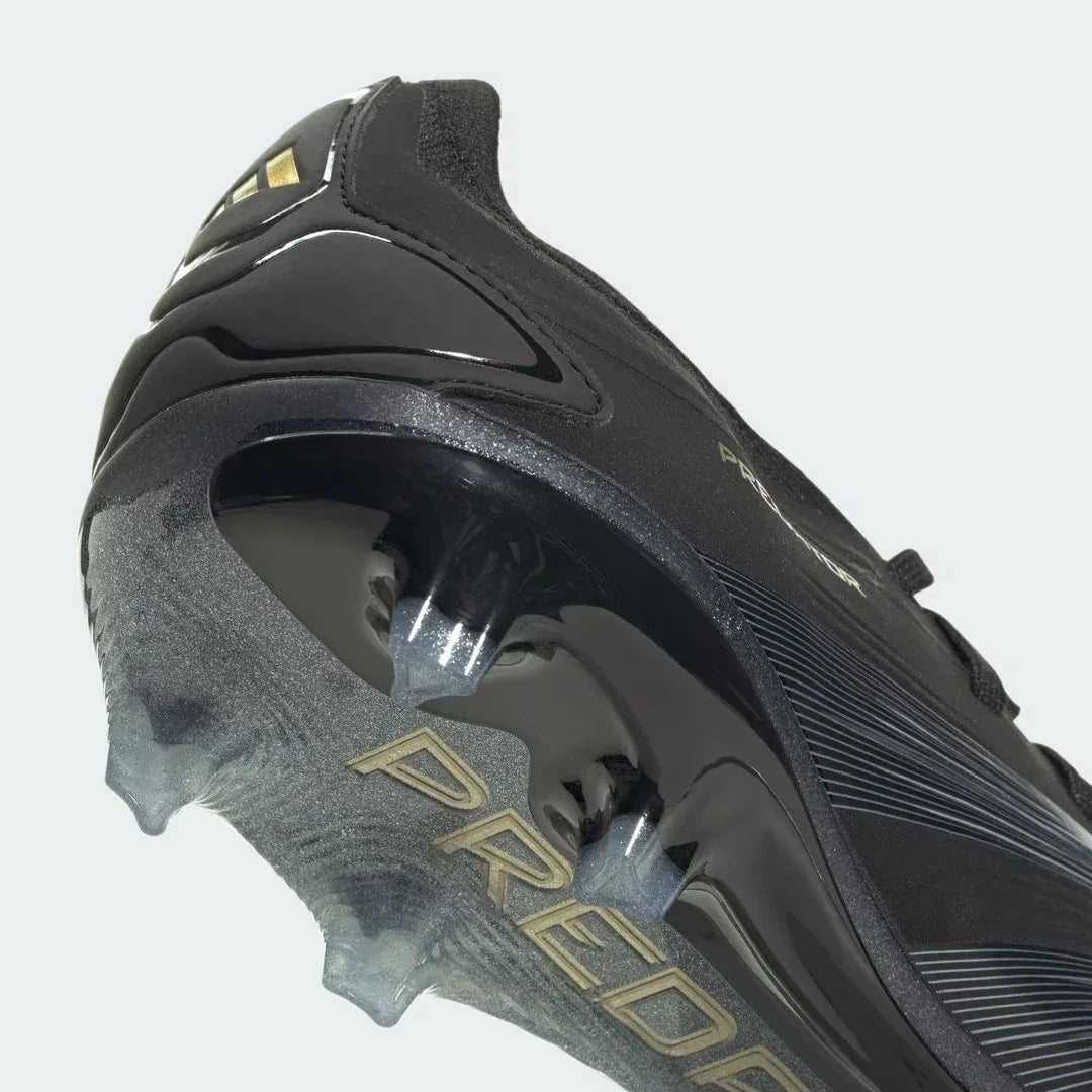 Detailed zoom on the sole of the Adidas Predator Pro FG men's boots, highlighting the firm ground stud pattern and the Controlframe technology.