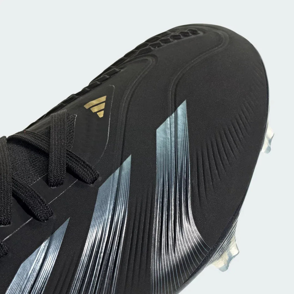 Close-up zoom on the front of the Adidas Predator Pro FG men's boots, showing the Strikeskin grip elements, lacing system, and HybridTouch upper.