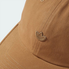 Zoom looking at the front of the hat and brim, highlighting the high-density tonal stitching of the logo.