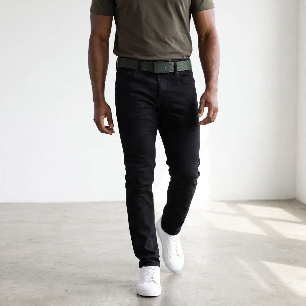Product shot showing a model wearing the belt ready for casual wear or golf use. 