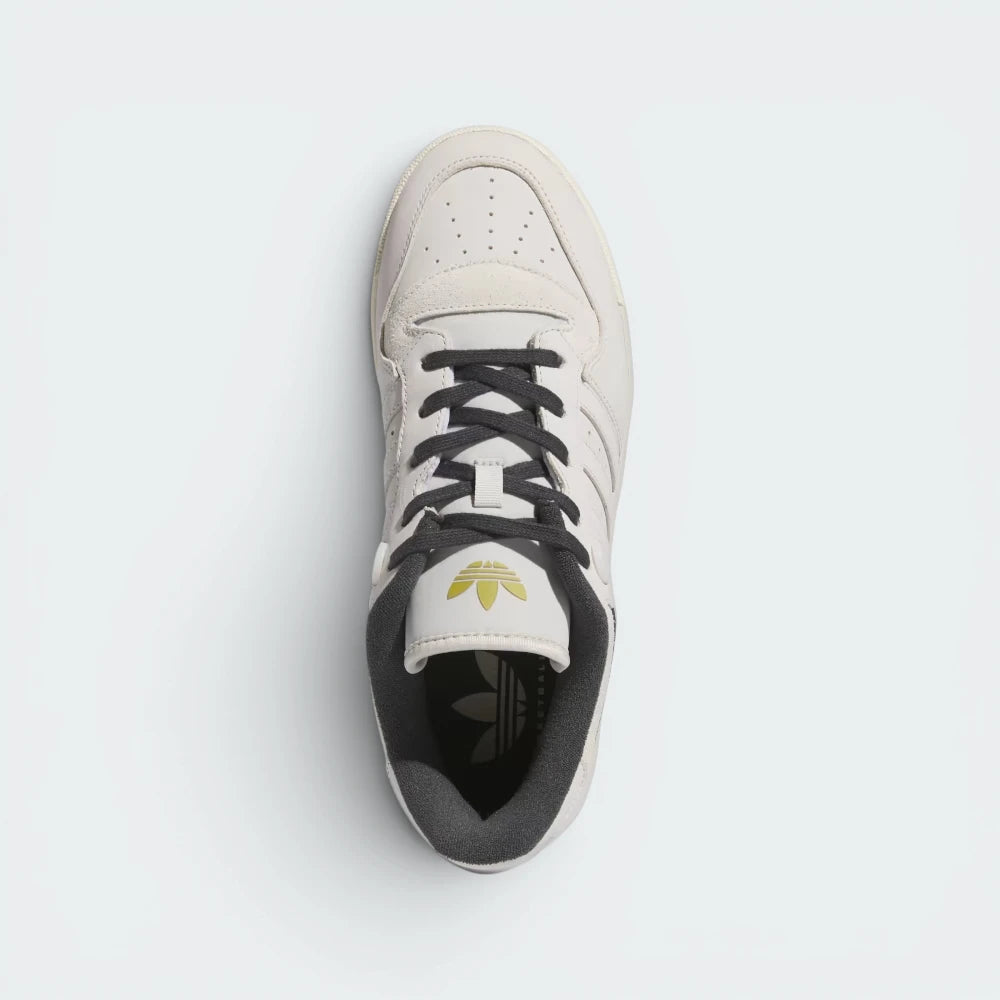 Focuses on the locked-in traditional lacing layout, displaying the perfect symmetry of the leather tongue, the printed adidas branding plate, and the intricate rows of perforations guarding the front toe box area.