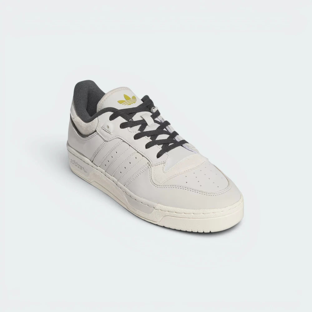 Emphasising the low-slung, sturdy retro silhouette and the professional harmony of the vintage talc and cream white contrast panels.