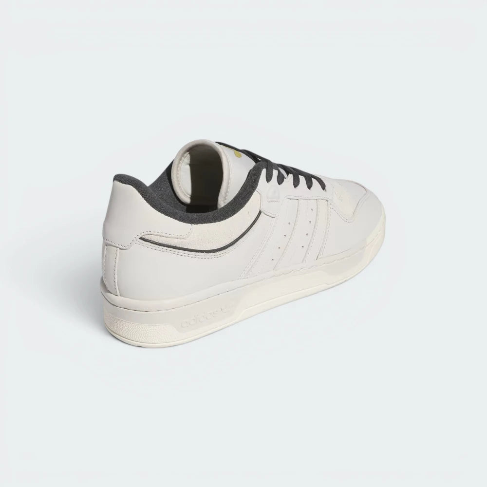 Focuses on the contoured shape of the rear heel counter, highlighting the deep carbon grey branding panel embellished with a clean white Trefoil logo.