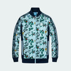 Adidas jacket with floral pattern on a light blue background