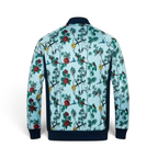 Floral and bird patterned jacket on a light blue background