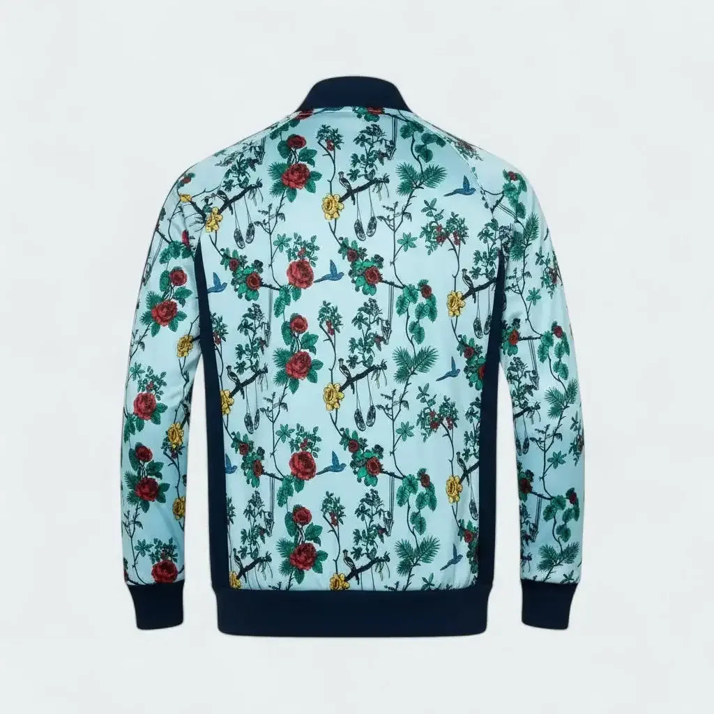 Floral and bird patterned jacket on a light blue background