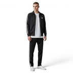 Focuses on the symmetry of the flat-laid track jacket, displaying the perfect alignment of the high stand-up funnel collar, the central zip track, and the balance of the embroidered Trefoil logo on the chest.