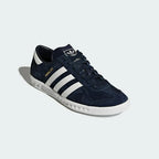 Angled view of adidas Hamburg Men's shoes highlighting premium suede texture and gold foil detail