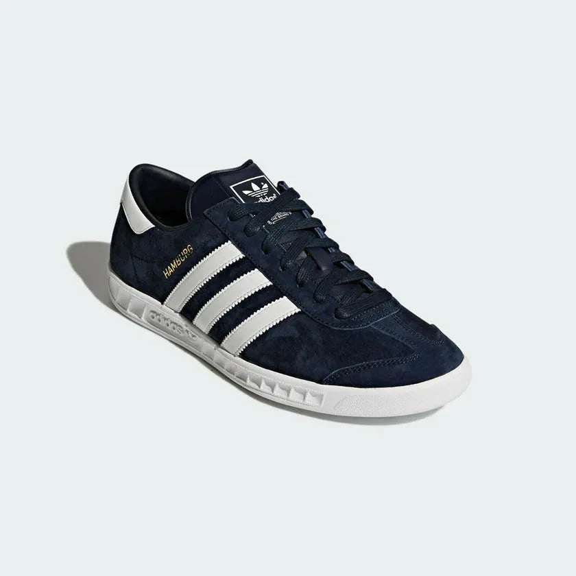Angled view of adidas Hamburg Men's shoes highlighting premium suede texture and gold foil detail
