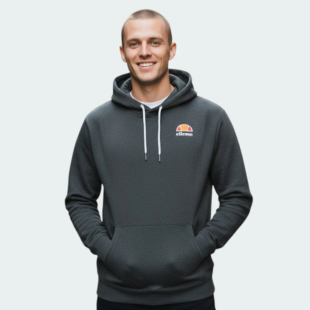 Ellesse Toce Overhead Hoodie Men's in charcoal, demonstrated with a model with hands inside the kangaroo pockets Main image