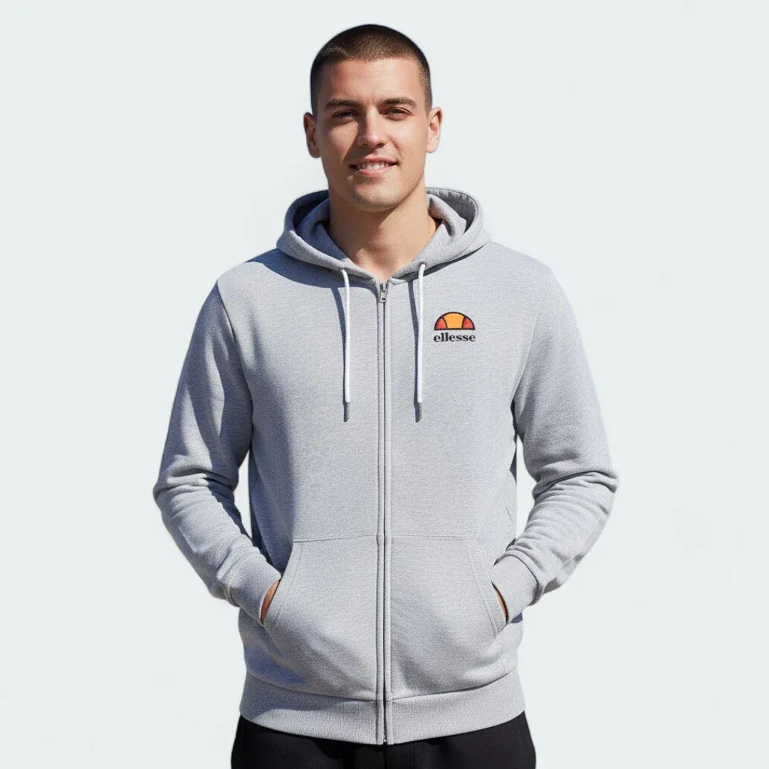 Ellesse Miletto Full-Zip Hoodie Men's in light grey, front view being worn by a model showing the full zipper, drawcord hood, split kangaroo pockets, and Ellesse logo on the chest. Main image
