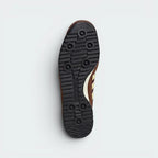 Focuses on the "locked-in" lacing system and the professional finish of the Ecotex textured tongue.