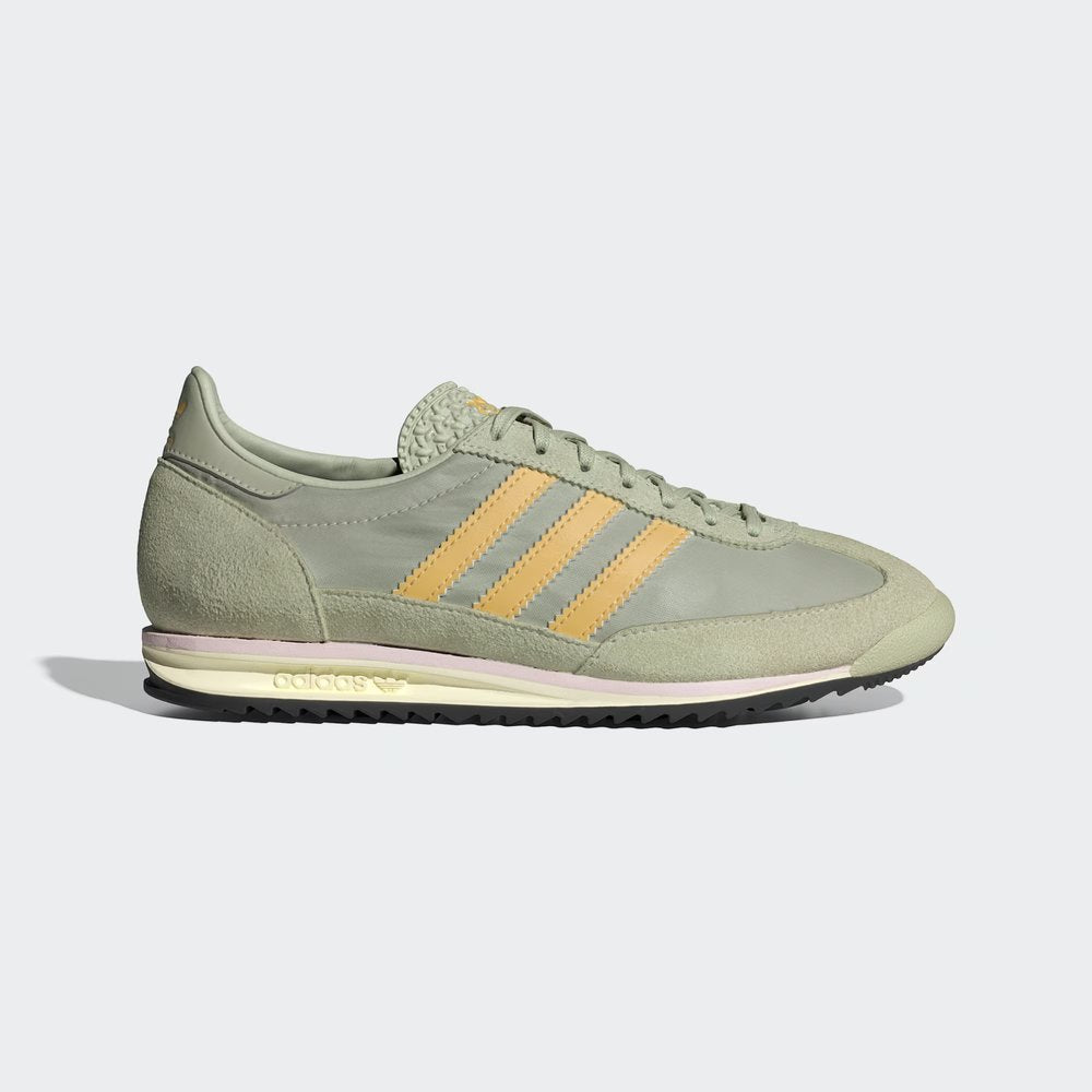 The Halo Green SL 72, highlighting the Almost Pink 3-Stripes and the slim, vintage-inspired EVA midsole.