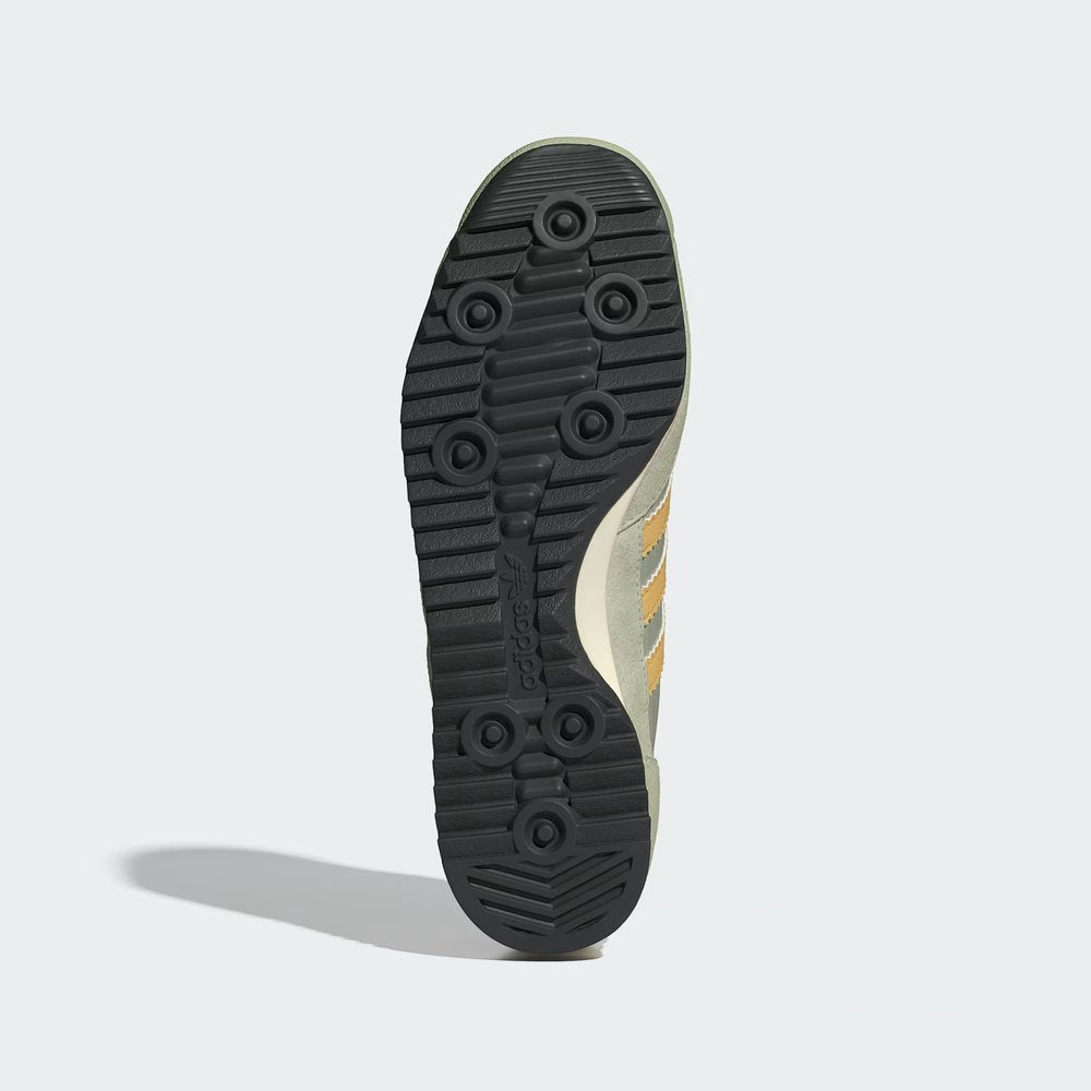 Showing the signature "cleat-inspired" traction pattern on the durable rubber sole.