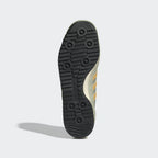 Showing the signature "cleat-inspired" traction pattern on the durable rubber sole.