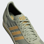 A close-up of the breathable nylon weave and the precision suede stitching on the toe cap.