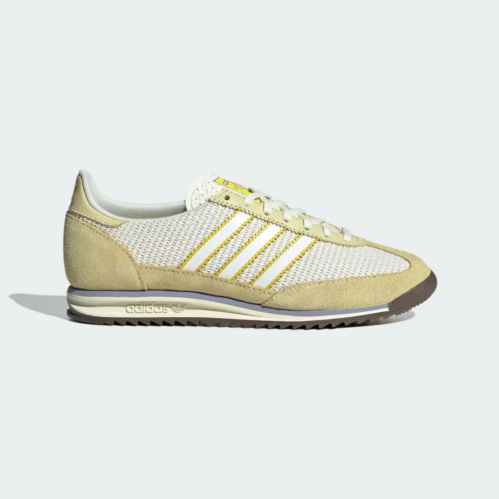The Ivory SL 72 OG, highlighting the slim profile and the vibrant Power Yellow Three-Stripes against the neutral nylon.