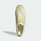Looking down at the symmetrical lacing system and the contrast yellow tongue detailing.