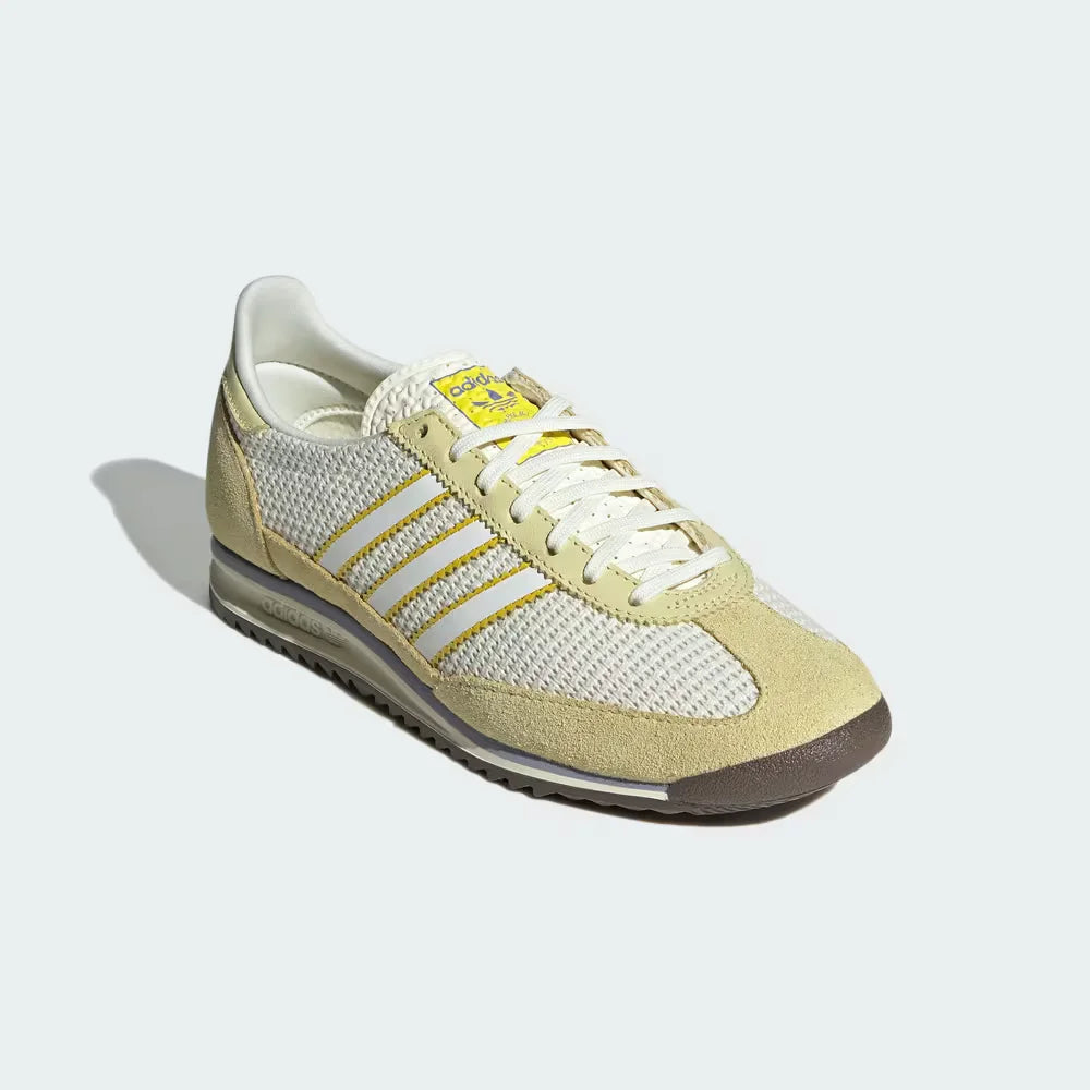 Emphasising the contrast between the ivory nylon and the premium yellow suede overlays.