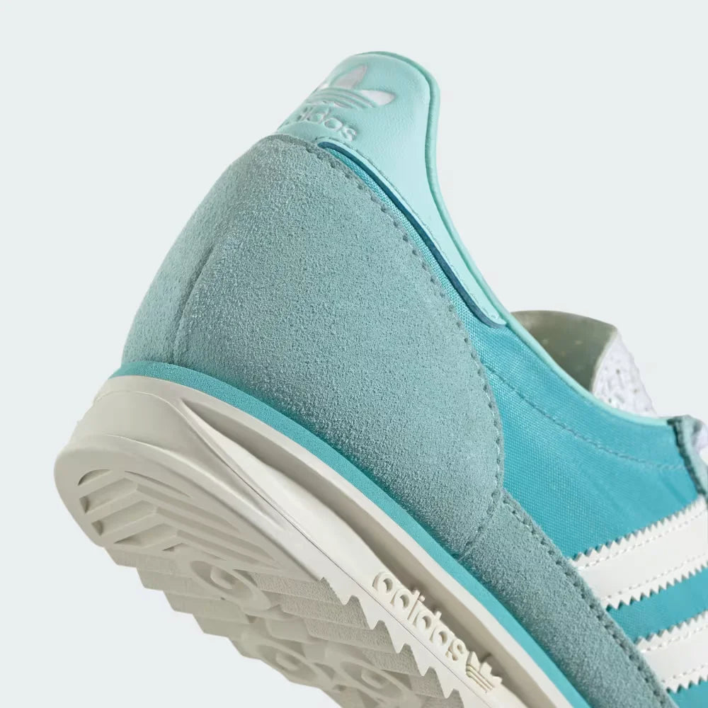 Highlighting the layered cushioning of the EVA unit and the textured grain of the rubber outsole.
