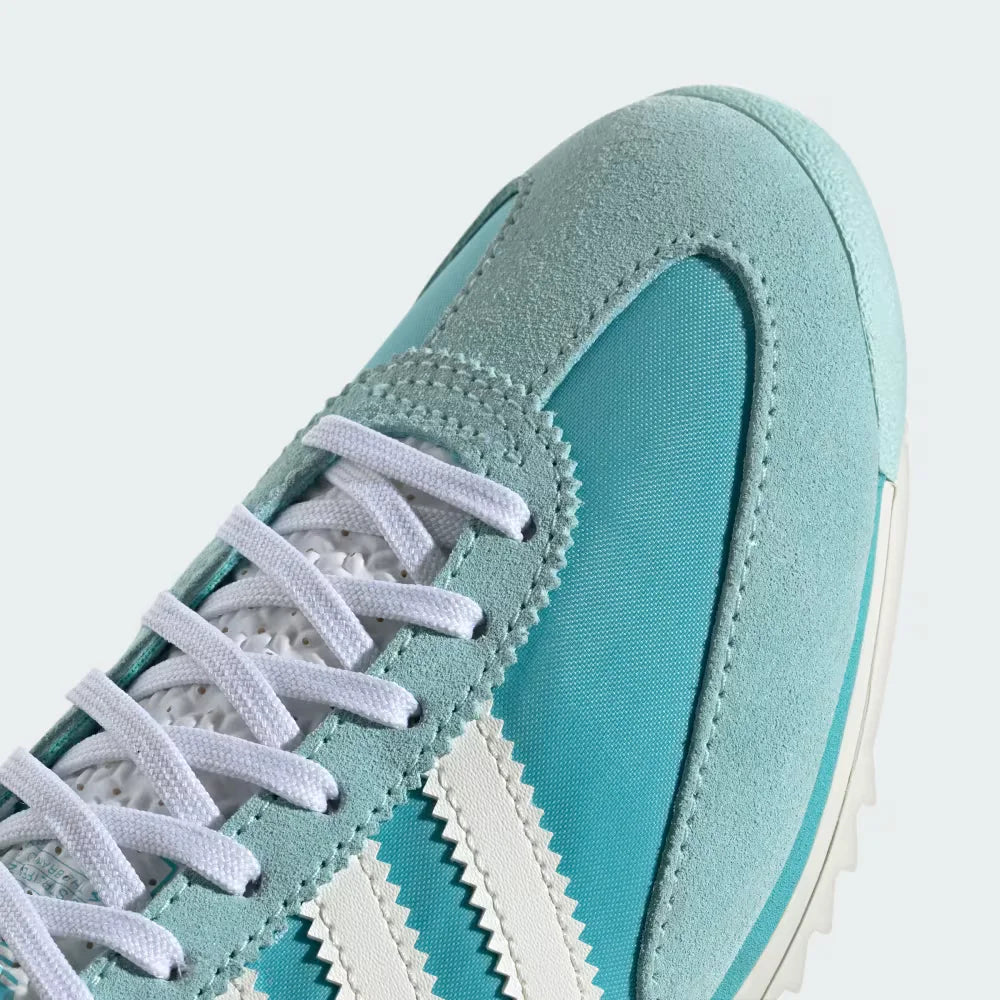 A close-up of the fine nylon weave and the precision-stitched suede reinforcements around the toe box.