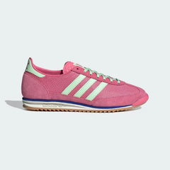 The Pink Fusion SL 72 OG, highlighting the slim profile and the vibrant Semi Green Spark Three-Stripes against the pink nylon.