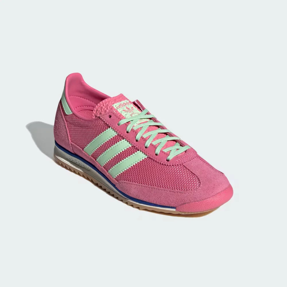Emphasising the contrast between the pink nylon and the premium green suede overlays.