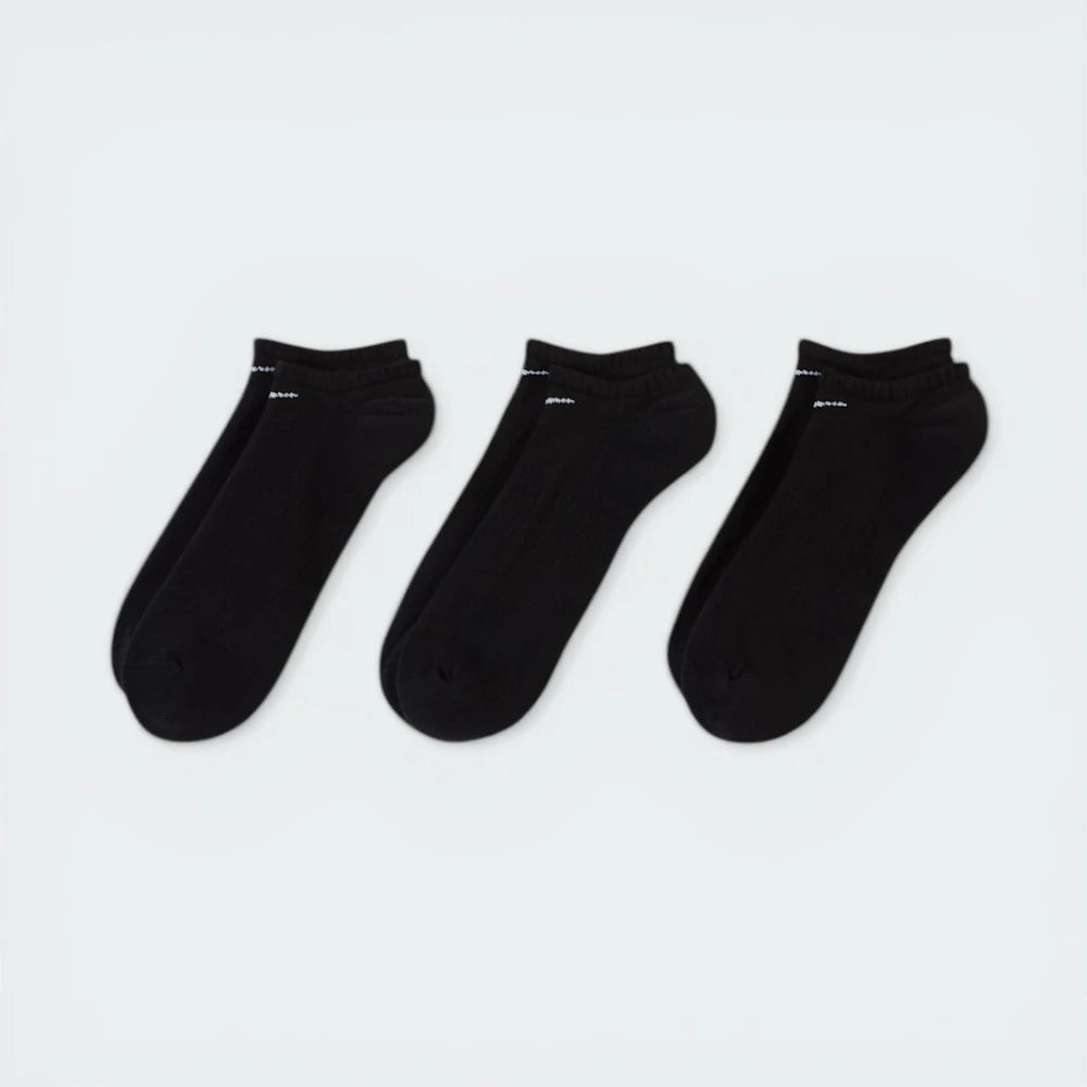 Looking down at the three pairs laid out, showcasing the sleek, non-bulky knit and the anatomical shape.