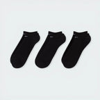 Looking down at the three pairs laid out, showcasing the sleek, non-bulky knit and the anatomical shape.