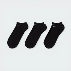 Looking down at the three pairs laid out, showcasing the sleek, non-bulky knit and the anatomical shape.