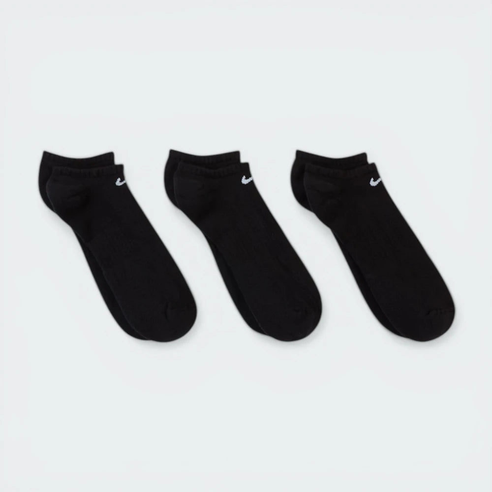 Looking down at the three pairs laid out, showcasing the sleek, non-bulky knit and the anatomical shape.