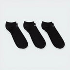 Looking down at the three pairs laid out, showcasing the sleek, non-bulky knit and the anatomical shape.