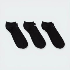 Looking down at the three pairs laid out, showcasing the sleek, non-bulky knit and the anatomical shape.