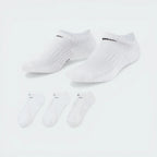 The white no-show sock, highlighting the high-contrast black Nike Swoosh on the top of the foot.